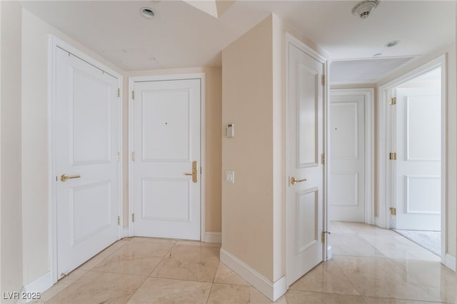 2877 Paradise Rd Unit 1806, Las Vegas, NV 89109 - corridor with baseboards and light marble finish flooring