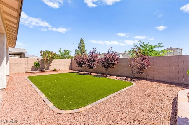 view of yard with a fenced backyard