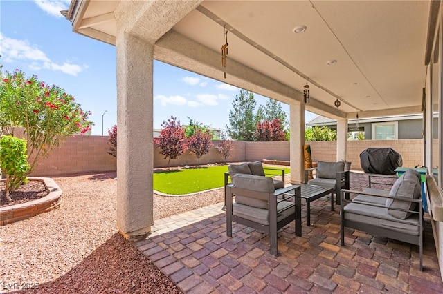 view of patio / terrace with an outdoor hangout area and a fenced backyard