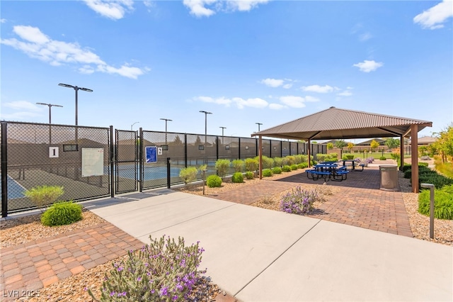 surrounding community with a gate, a gazebo, and fence