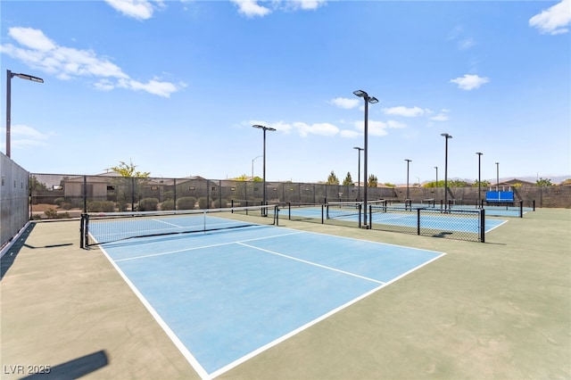 view of sport court with fence
