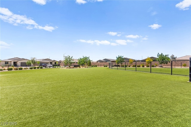 view of yard with fence and a residential view