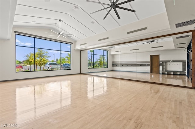spare room featuring a ceiling fan and visible vents