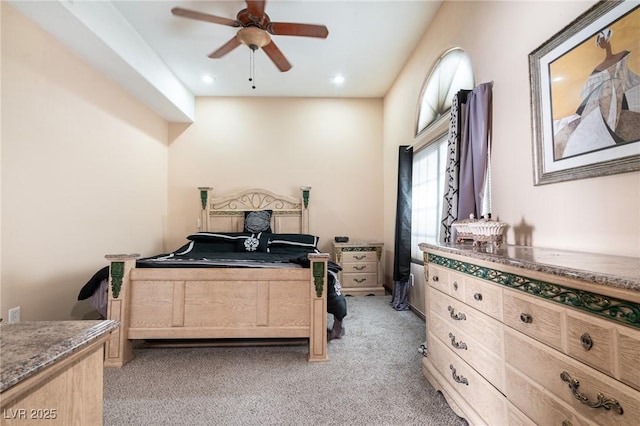 bedroom with light carpet, a ceiling fan, and recessed lighting