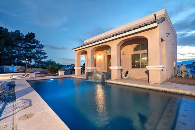 view of swimming pool with a patio and a fenced in pool