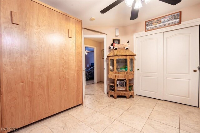 corridor featuring light tile patterned floors
