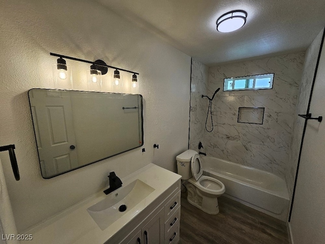 full bathroom featuring shower / bath combination, vanity, toilet, and wood finished floors