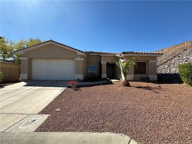 3567 Cottage Stream Ct, Laughlin, NV 89029 - view of front facade with stucco siding, an attached garage, driveway, and a tile roof