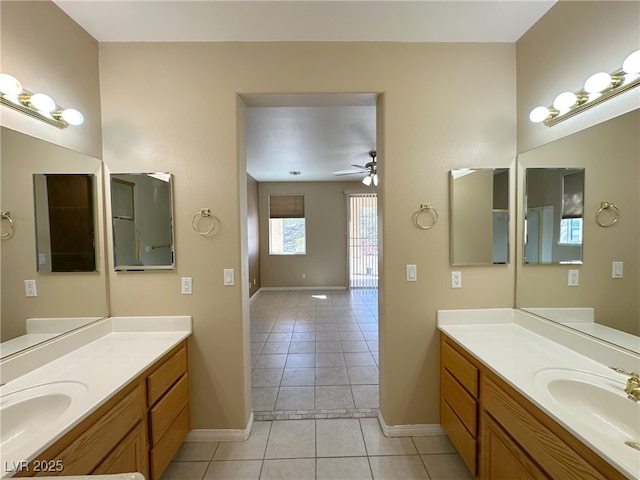 3567 Cottage Stream Ct, Laughlin, NV 89029 - full bathroom featuring tile patterned flooring, baseboards, ceiling fan, and two vanities
