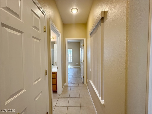 3567 Cottage Stream Ct, Laughlin, NV 89029 - corridor with light tile patterned flooring and baseboards