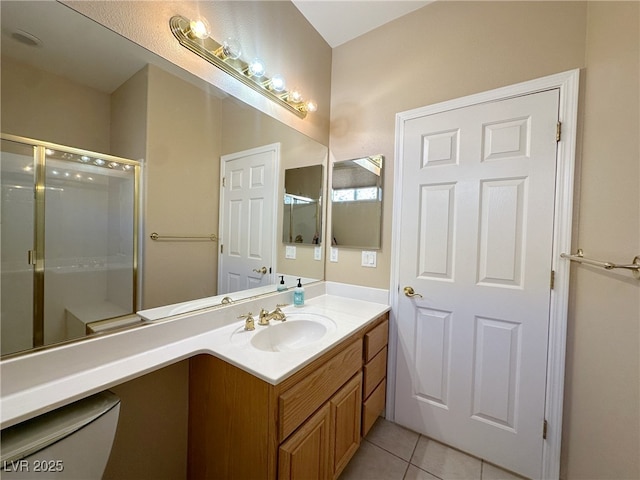3567 Cottage Stream Ct, Laughlin, NV 89029 - bathroom featuring vanity, tile patterned floors, and a shower stall