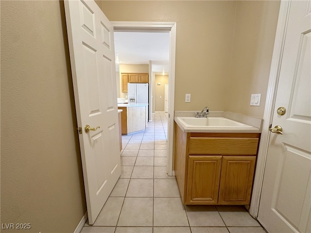 bathroom with tile patterned floors and a sink