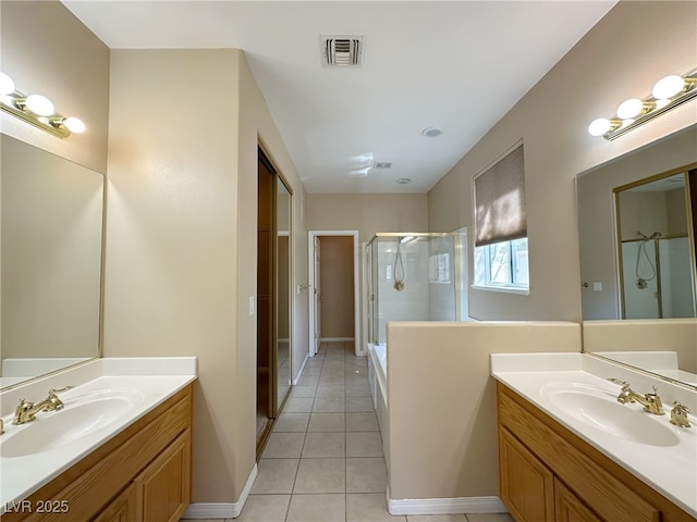 3567 Cottage Stream Ct, Laughlin, NV 89029 - full bathroom with a stall shower, tile patterned floors, two vanities, and baseboards
