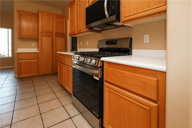 3567 Cottage Stream Ct, Laughlin, NV 89029 - kitchen featuring stainless steel appliances, light countertops, and light tile patterned floors