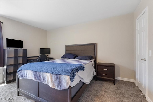 bedroom with baseboards and carpet
