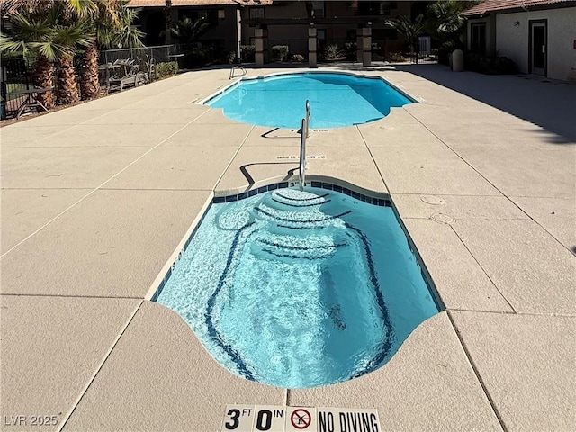 2606 S Durango Dr Unit 260, Las Vegas, NV 89117 - community pool featuring a patio