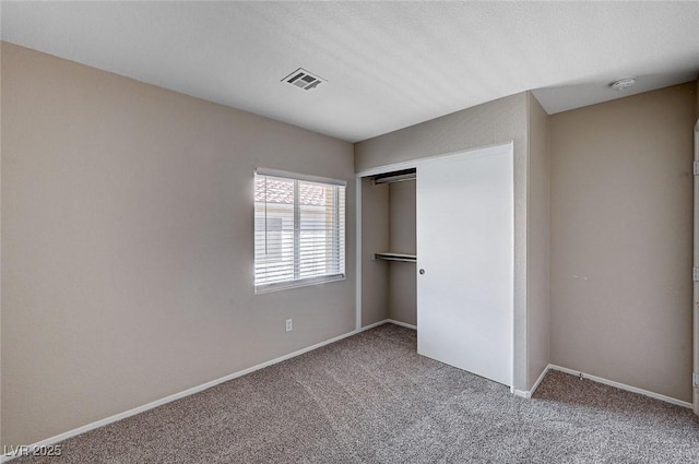8028 Hurricane Cove Ct, Las Vegas, NV 89129 - unfurnished bedroom with baseboards, visible vents, carpet floors, and a closet