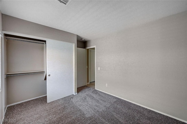 8028 Hurricane Cove Ct, Las Vegas, NV 89129 - unfurnished bedroom featuring visible vents, baseboards, carpet flooring, and a closet