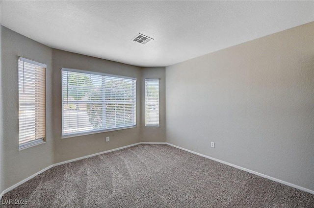 8028 Hurricane Cove Ct, Las Vegas, NV 89129 - unfurnished room with carpet floors, visible vents, and baseboards