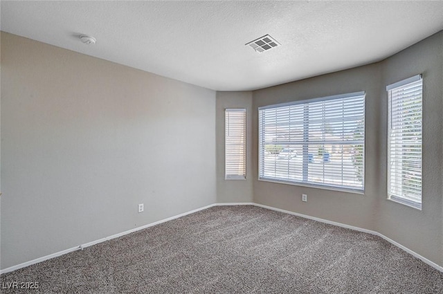8028 Hurricane Cove Ct, Las Vegas, NV 89129 - carpeted spare room featuring baseboards, visible vents, and plenty of natural light