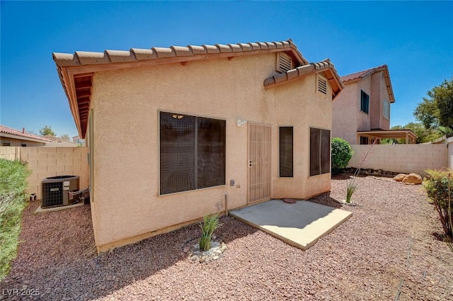 8028 Hurricane Cove Ct, Las Vegas, NV 89129 - back of property featuring stucco siding, fence, a patio area, and cooling unit