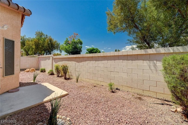 8028 Hurricane Cove Ct, Las Vegas, NV 89129 - view of yard featuring a patio area and a fenced backyard