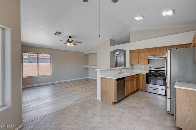 8028 Hurricane Cove Ct, Las Vegas, NV 89129 - kitchen featuring stainless steel appliances, visible vents, lofted ceiling, ceiling fan, and under cabinet range hood