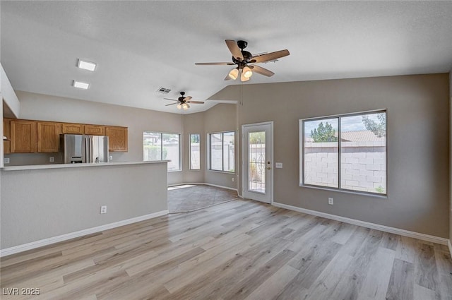 8028 Hurricane Cove Ct, Las Vegas, NV 89129 - unfurnished living room featuring vaulted ceiling, visible vents, light wood-style floors, baseboards, and ceiling fan