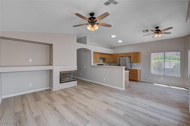 8028 Hurricane Cove Ct, Las Vegas, NV 89129 - unfurnished living room featuring vaulted ceiling, visible vents, and ceiling fan