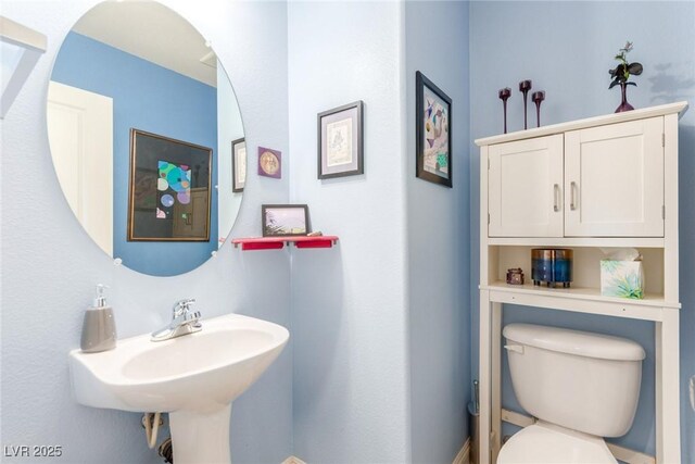 half bathroom with toilet