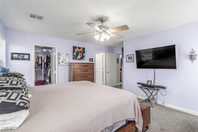 bedroom with a closet, ceiling fan, baseboards, carpet flooring, and visible vents