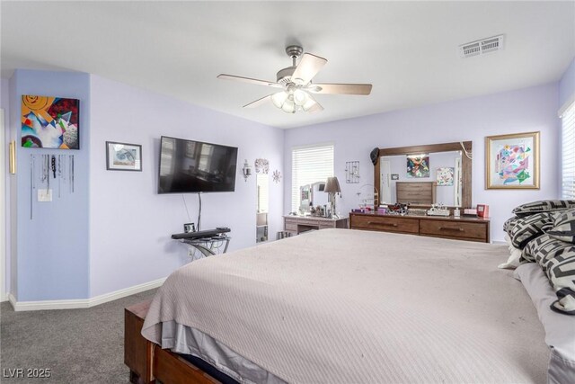 carpeted bedroom with visible vents, baseboards, and ceiling fan
