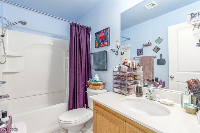 bathroom featuring visible vents, toilet, vanity, and shower / bath combination with curtain