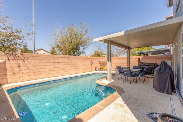 view of pool with a fenced backyard, a fenced in pool, and a patio
