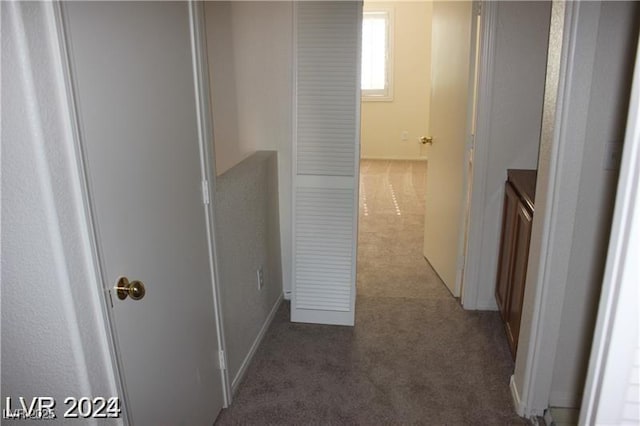 hall with carpet flooring