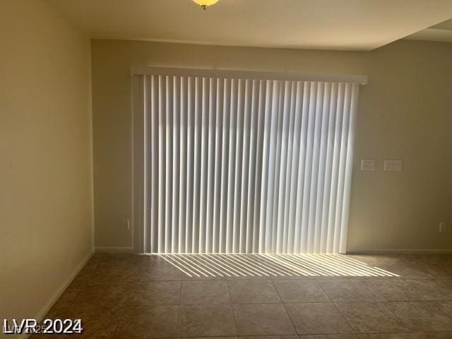 tiled spare room with baseboards