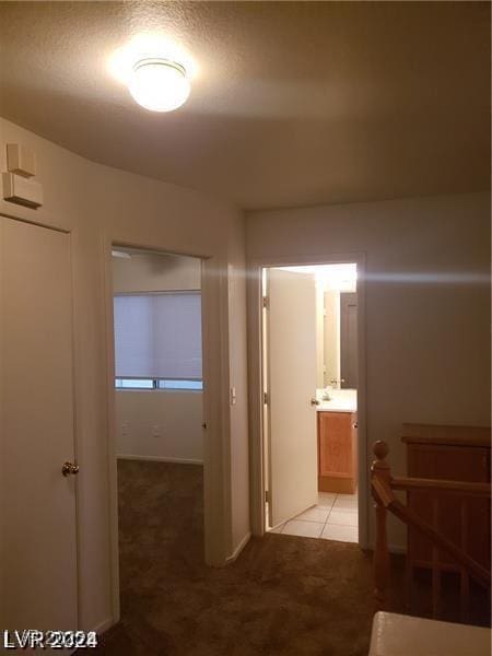 hallway with light carpet
