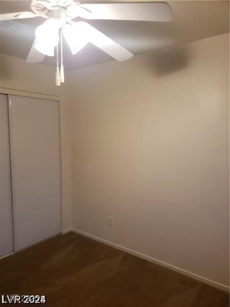 empty room featuring baseboards and ceiling fan