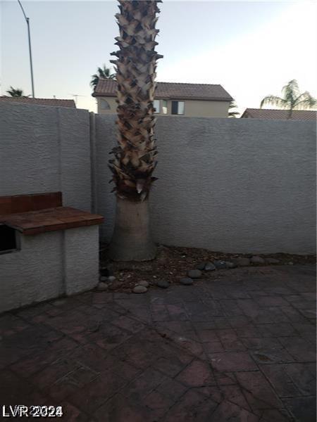 view of patio featuring fence