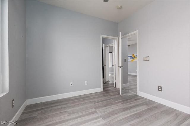 689 Principle Point Ave, Henderson, NV 89012 - unfurnished bedroom featuring wood finished floors and baseboards