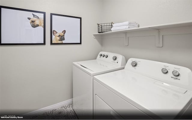 clothes washing area with washer and dryer and laundry area
