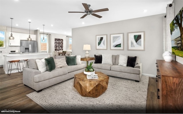 living area with recessed lighting, ceiling fan, and dark wood-style flooring
