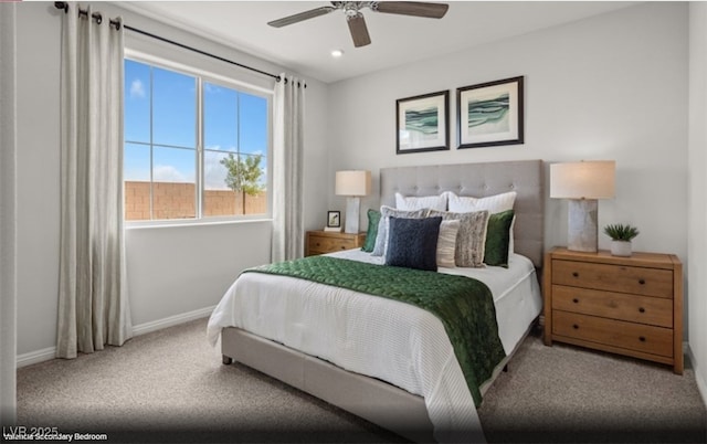 carpeted bedroom with baseboards and ceiling fan
