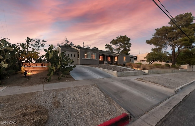 650 Arizona St, Boulder City, NV 89005 - view of front of house with concrete driveway and an attached garage