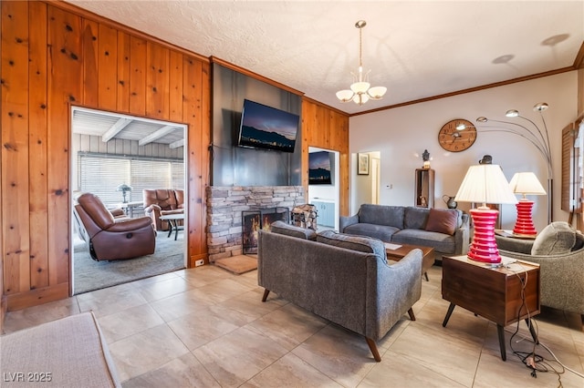 650 Arizona St, Boulder City, NV 89005 - living room featuring wooden walls, a stone fireplace, a notable chandelier, and ornamental molding