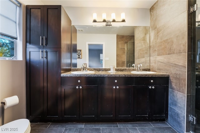 650 Arizona St, Boulder City, NV 89005 - bathroom featuring toilet, tile patterned floors, a sink, and double vanity
