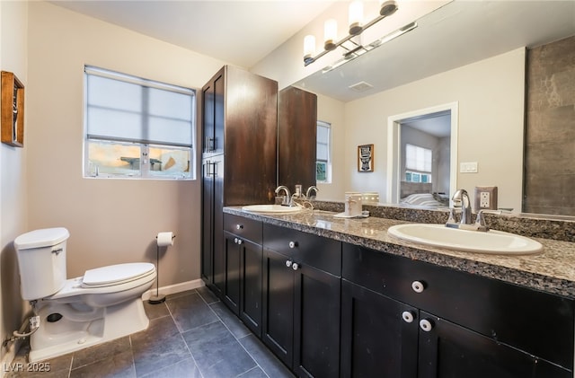 650 Arizona St, Boulder City, NV 89005 - bathroom featuring a sink, double vanity, toilet, tile patterned flooring, and visible vents
