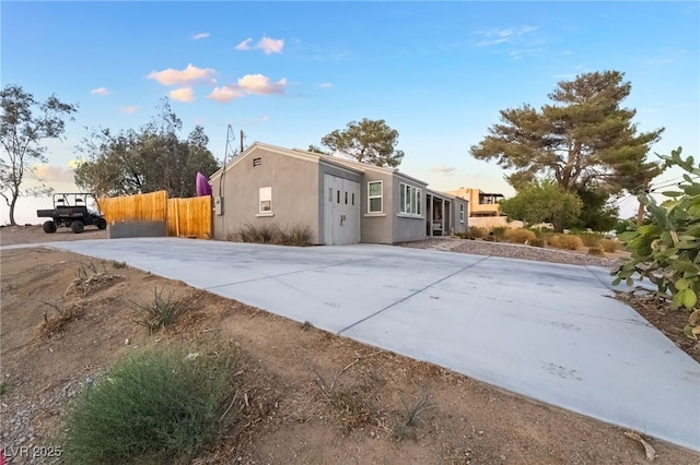650 Arizona St, Boulder City, NV 89005 - view of property exterior with fence and stucco siding
