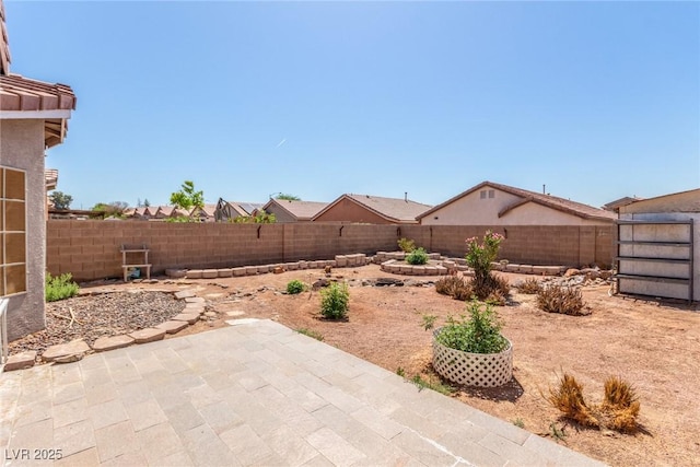 view of yard featuring a fenced backyard and a patio