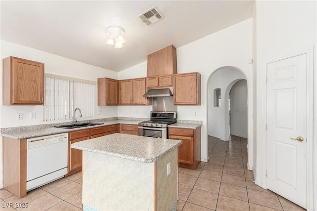 kitchen with lofted ceiling, under cabinet range hood, a sink, white dishwasher, and electric range
